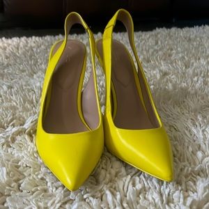 For sale: Gently worn Aldo yellow pointed shoes.